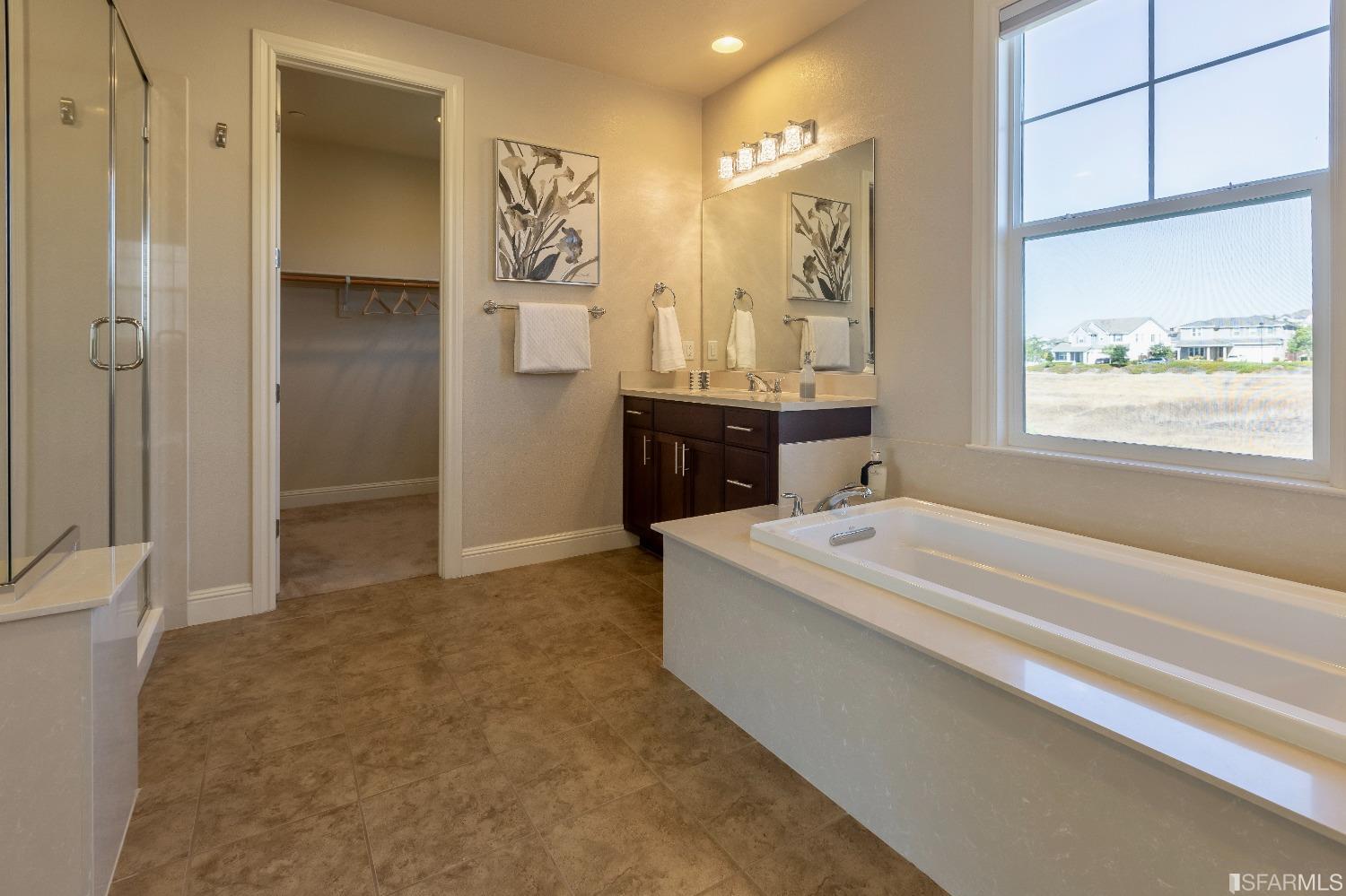 4456 Sunset View Drive Dublin, CA 94568 - Photo 25 of 40 a spacious bathroom with a tub sink and mirror