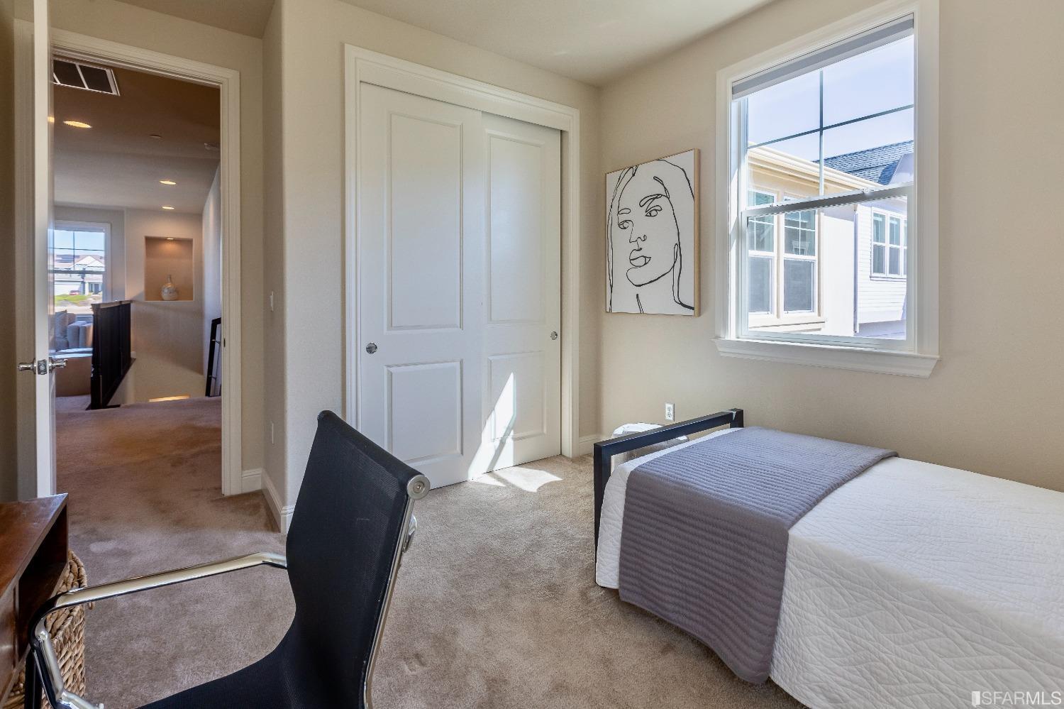 4456 Sunset View Drive Dublin, CA 94568 - Photo 33 of 40 a bedroom with a bed and a chandelier