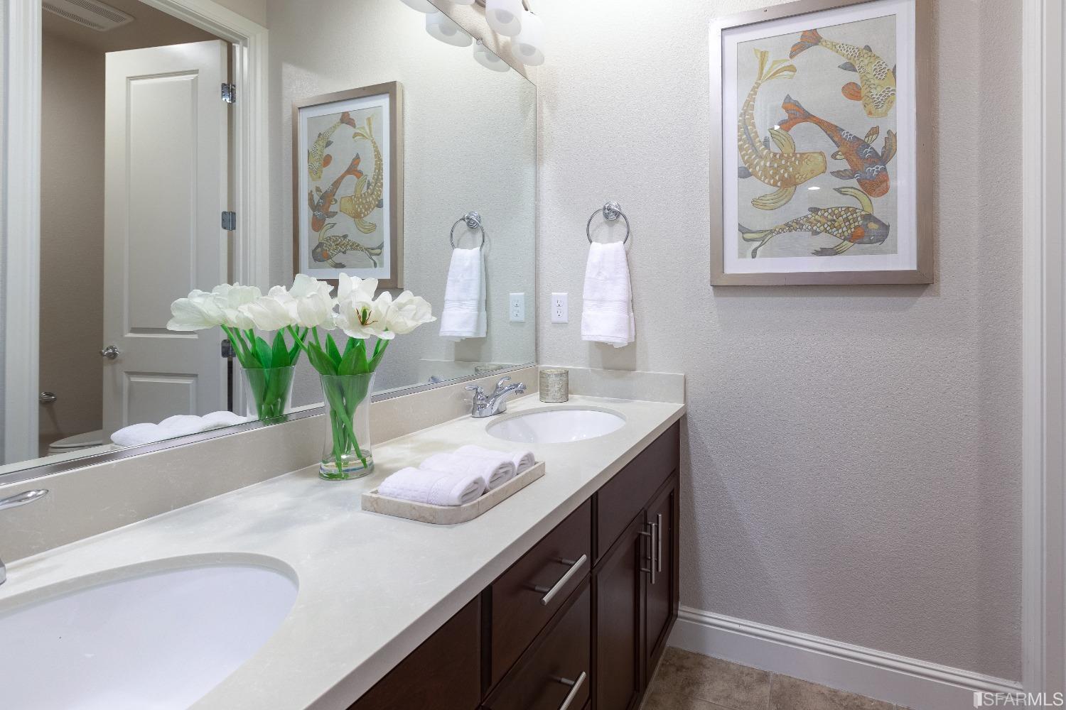 4456 Sunset View Drive Dublin, CA 94568 - Photo 34 of 40 a bathroom with a granite countertop sink and a mirror