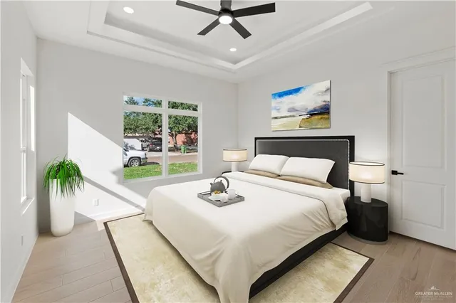 a bedroom with a bed and a large window