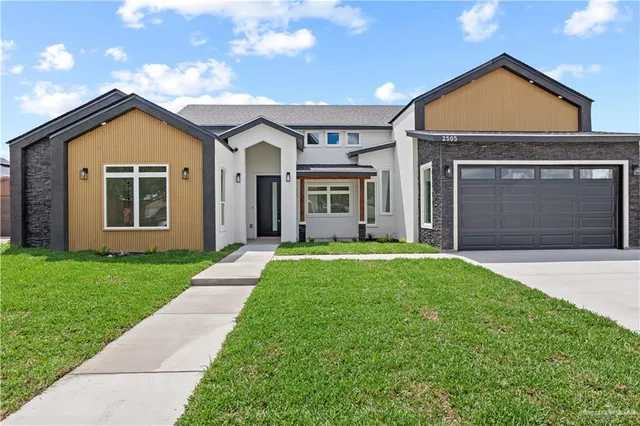 front view of a house with a yard