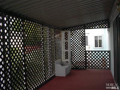 316 Candy Lane, Unit 62 Santa Rosa, CA 95403 - Photo 3 of 12 Enclosed porch adjoins the living room/family room area.