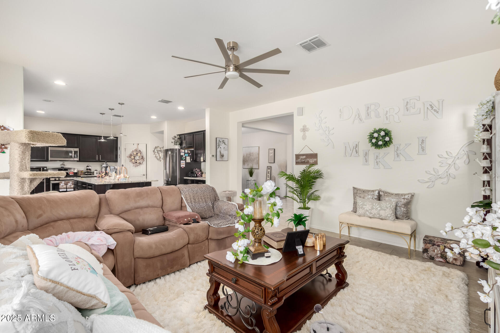 2665 East Gillcrest Road Gilbert, AZ 85298 - Photo 11 of 48 a living room with furniture kitchen view and a potted plant