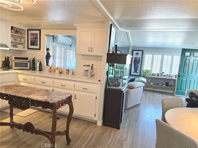 a view of kitchen with cabinets and wooden floor