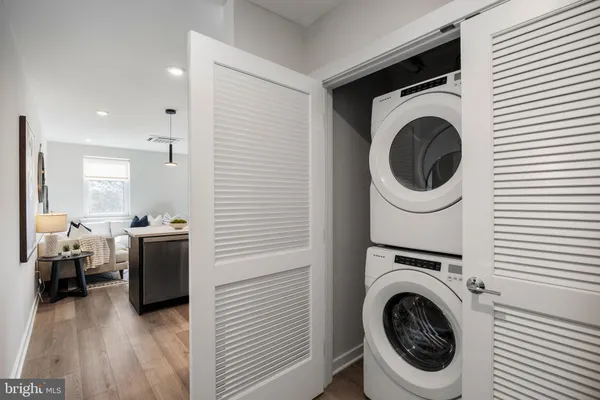 a view of a kitchen with washer and dryer