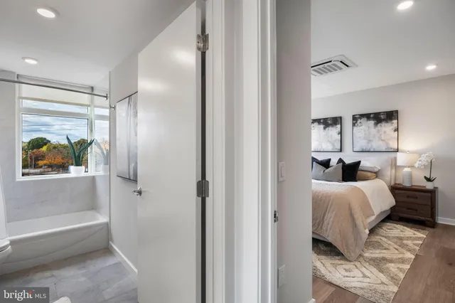 a en suite bathroom with a bathtub and a shower