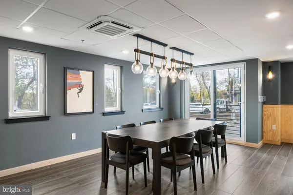 a view of a dining room with furniture window and wooden floor