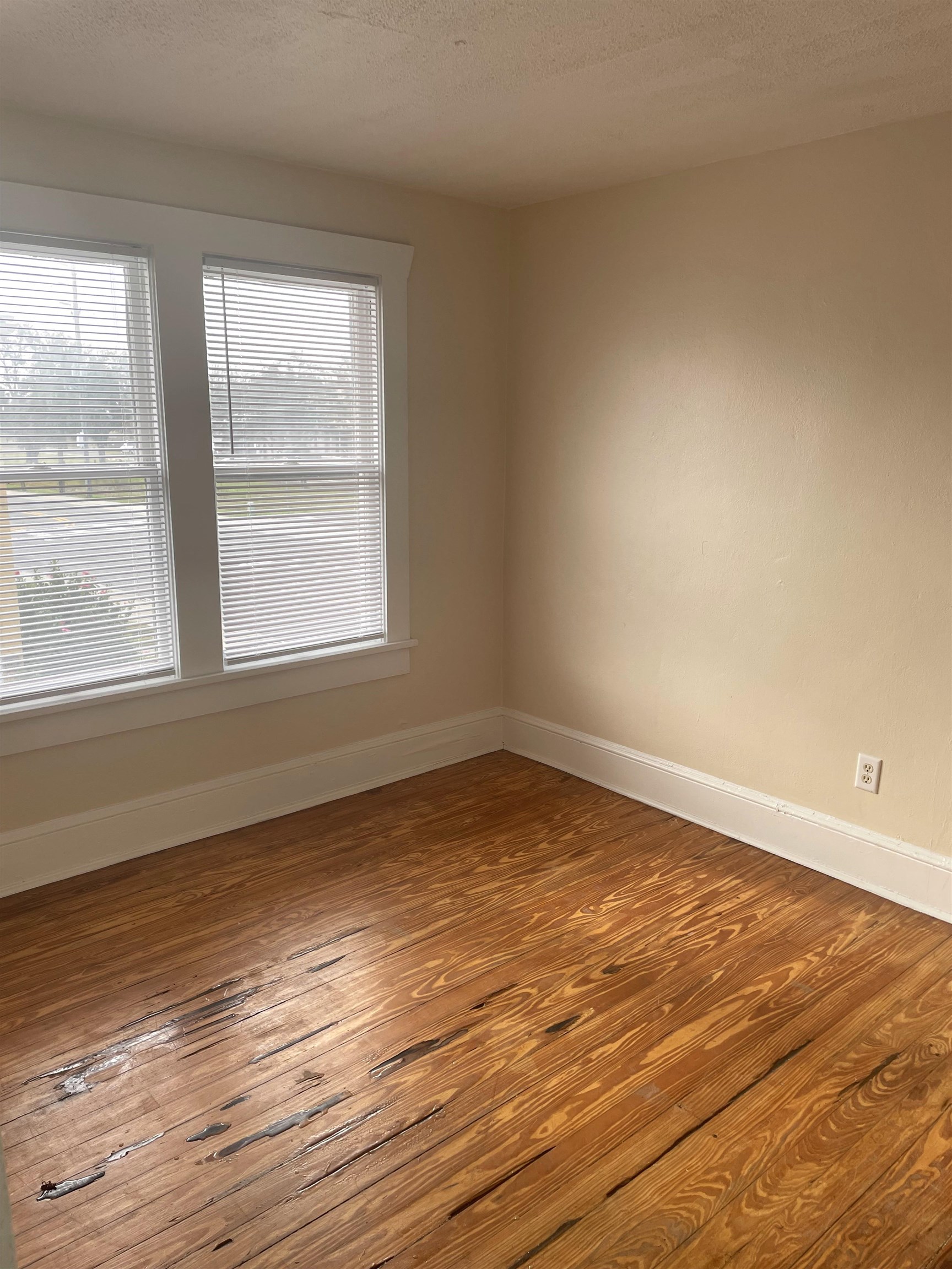 143 A Riberia Street St. Augustine, FL 32084 - Photo 8 of 11 Unfurnished room featuring a textured ceiling and wood-type flooring