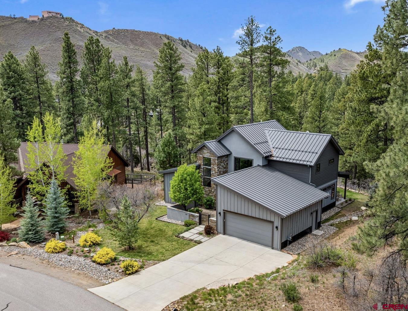 201 Window Lake Trail Durango, CO 81301 - Photo 1 of 45 a view of a house with a yard and covered sitting area