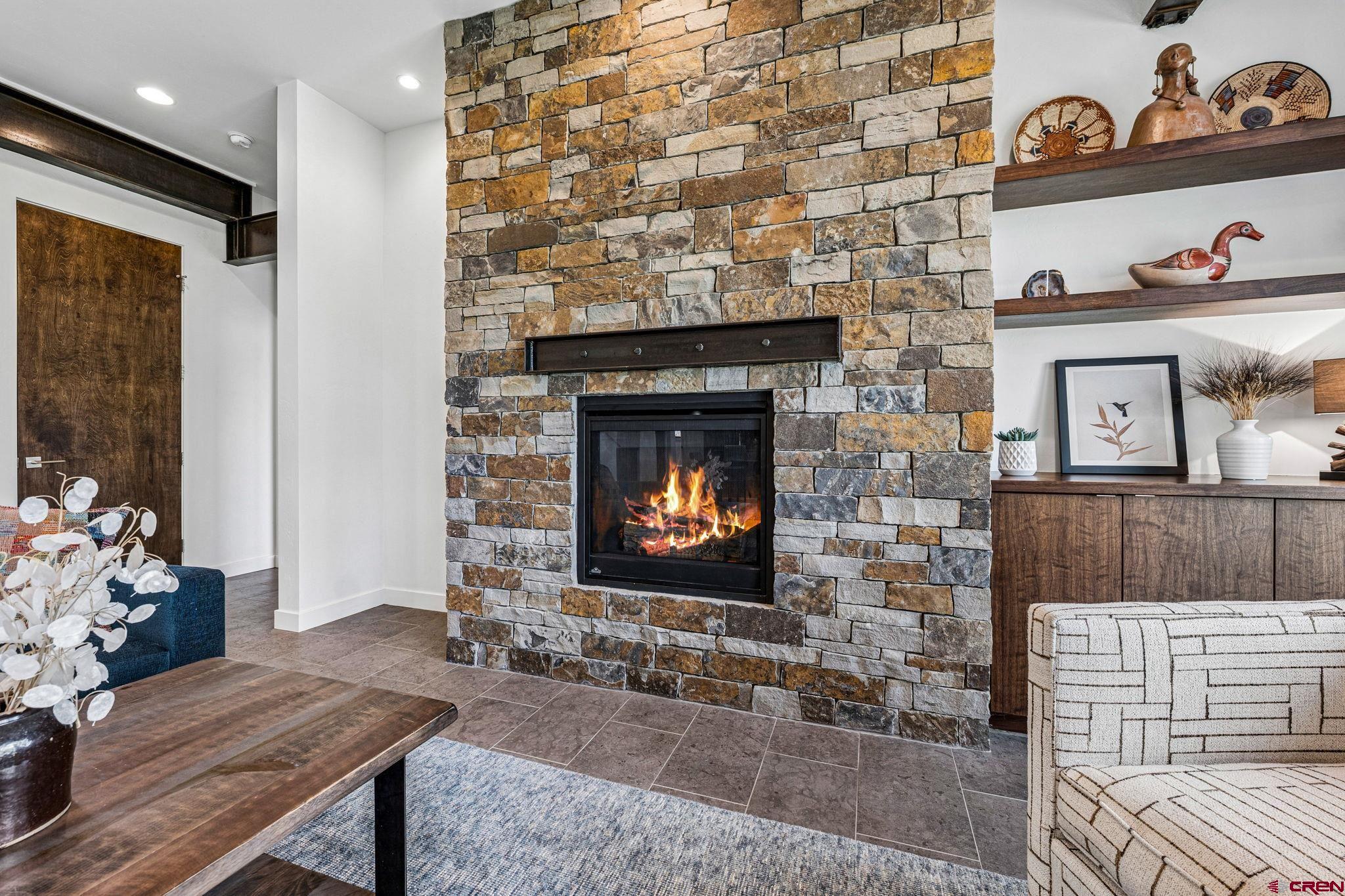 201 Window Lake Trail Durango, CO 81301 - Photo 11 of 45 a living room with furniture and a fireplace