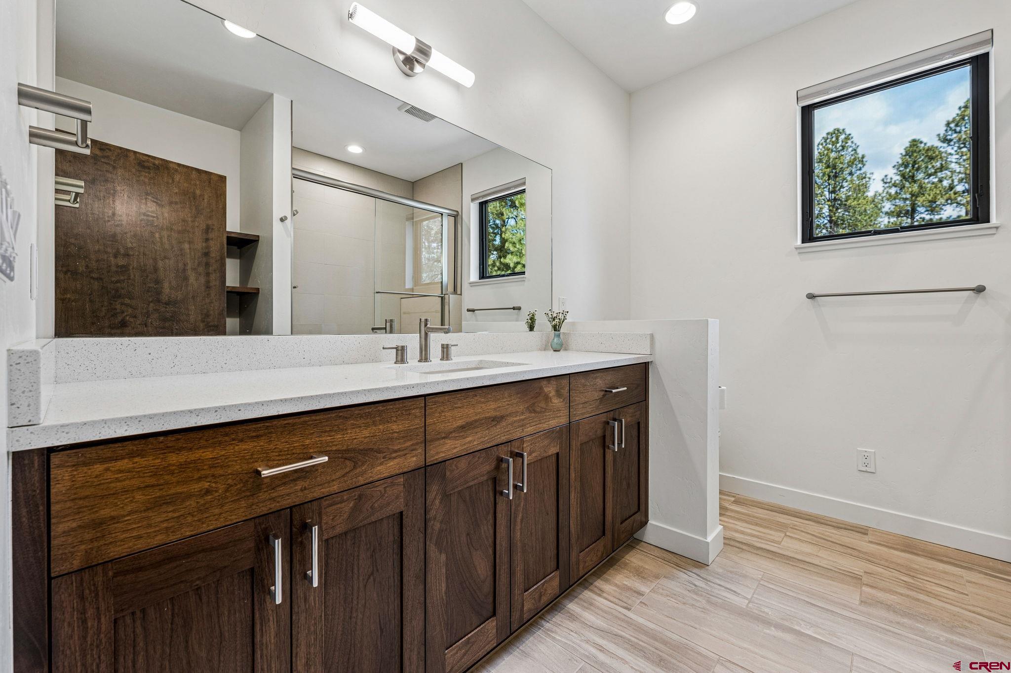 201 Window Lake Trail Durango, CO 81301 - Photo 35 of 45 a spacious bathroom with a double vanity sink and a mirror