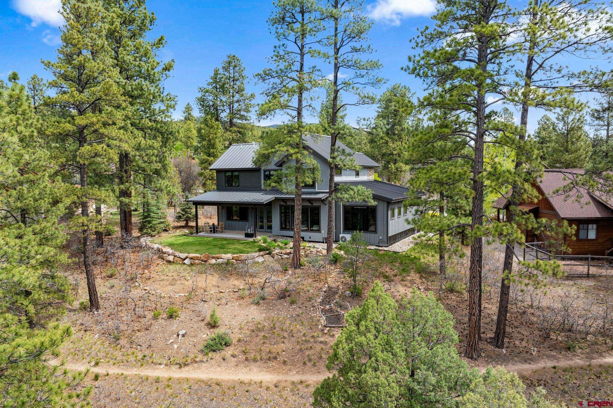 201 Window Lake Trail Durango, CO 81301 - Photo 42 of 45 a front view of a house with a yard