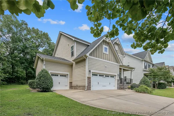a house that has a tree in front of the house