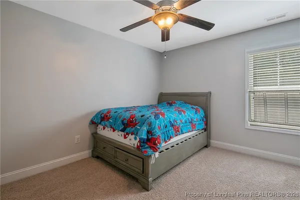 a view of a house with yard and tree s