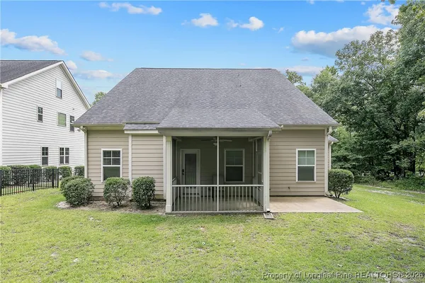 a view of outdoor space with green field and trees