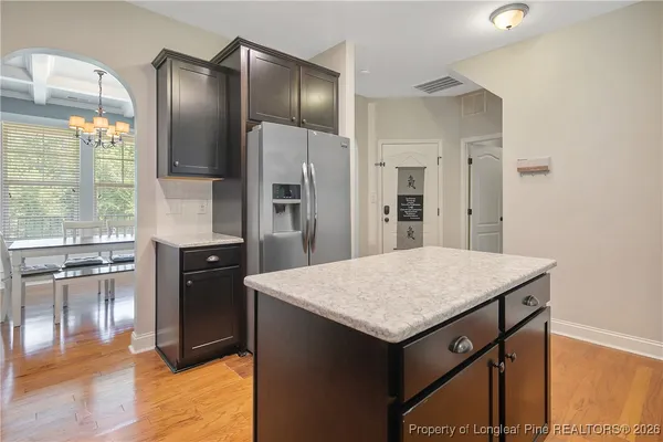 a kitchen that has a stainless steel appliances cabinets and a counter top space