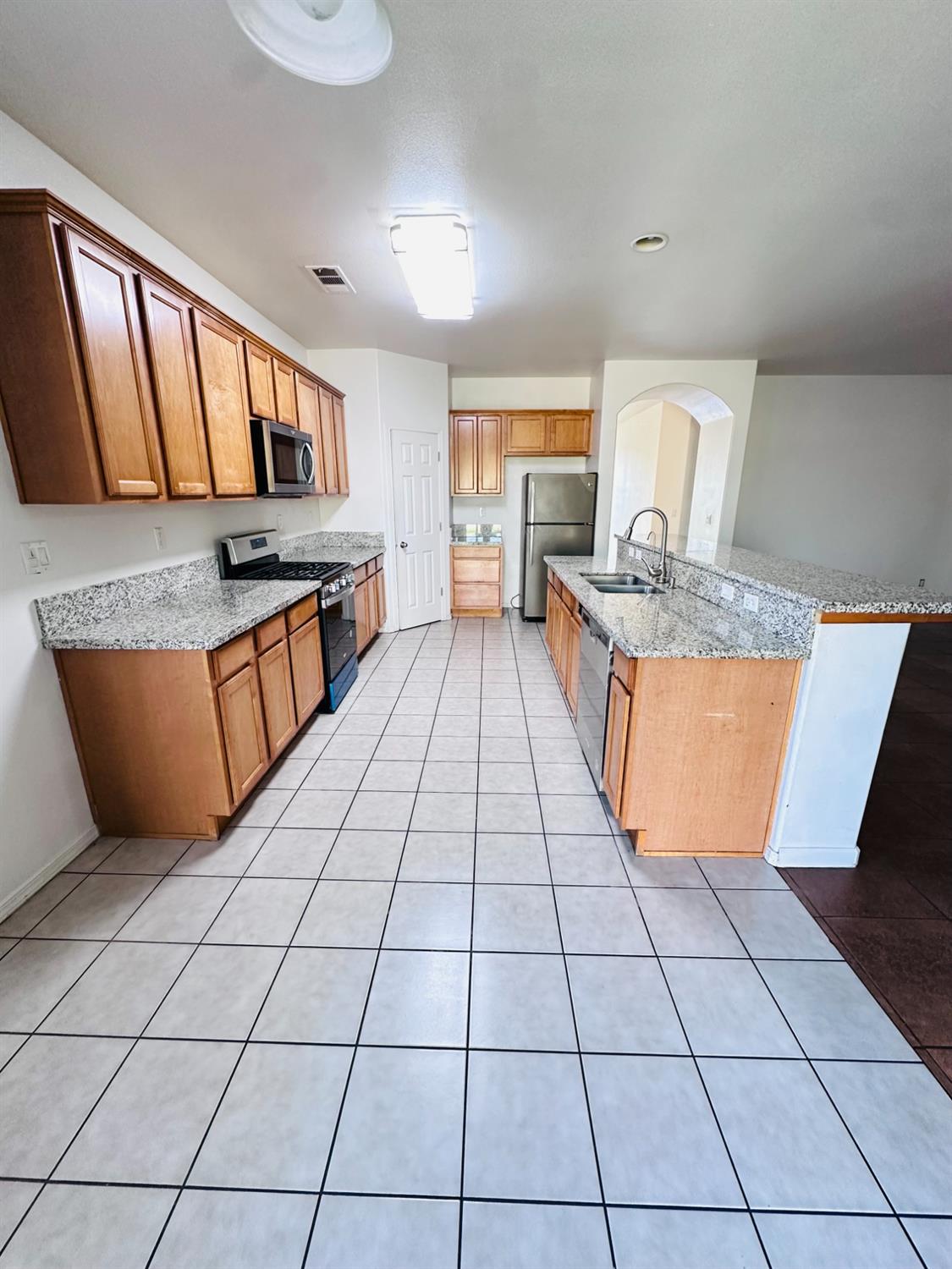 6642 East Cetti Avenue Fresno, CA 93727 - Photo 7 of 18 a view of kitchen with granite countertop window