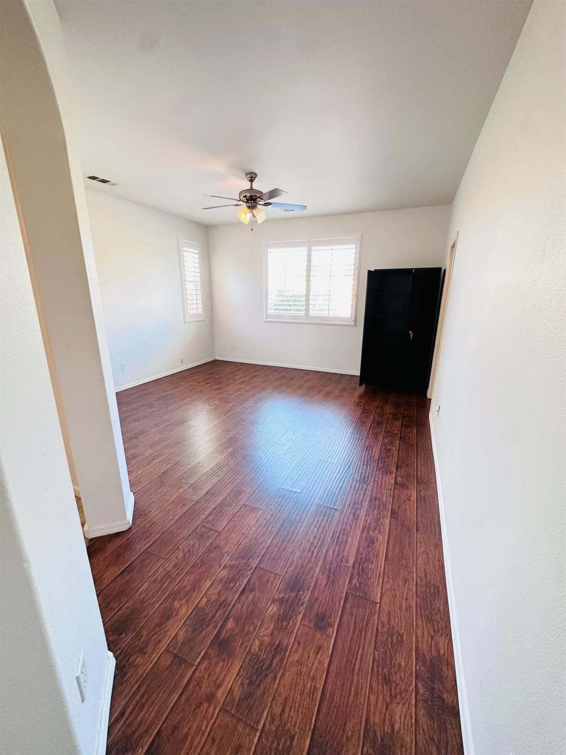 6642 East Cetti Avenue Fresno, CA 93727 - Photo 10 of 18 wooden floor in an empty room with a window