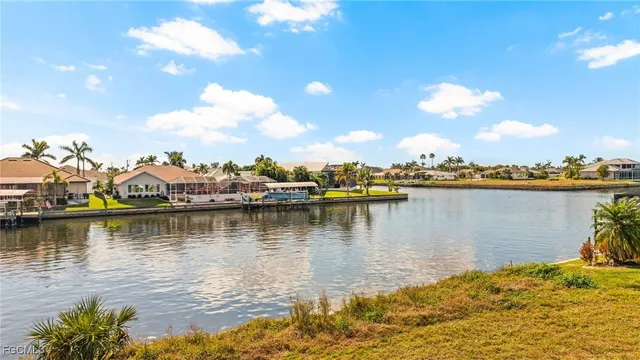 a view of a lake with boats and trees