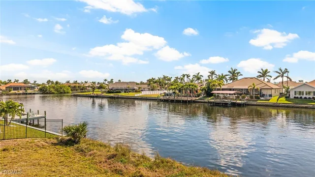 a view of a swimming pool with an outdoor seating
