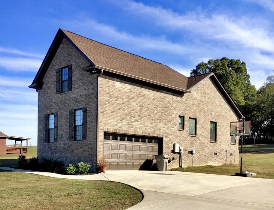1044 Luton Way White House, TN 37188 - Photo 2 of 26 a front view of a house with a yard