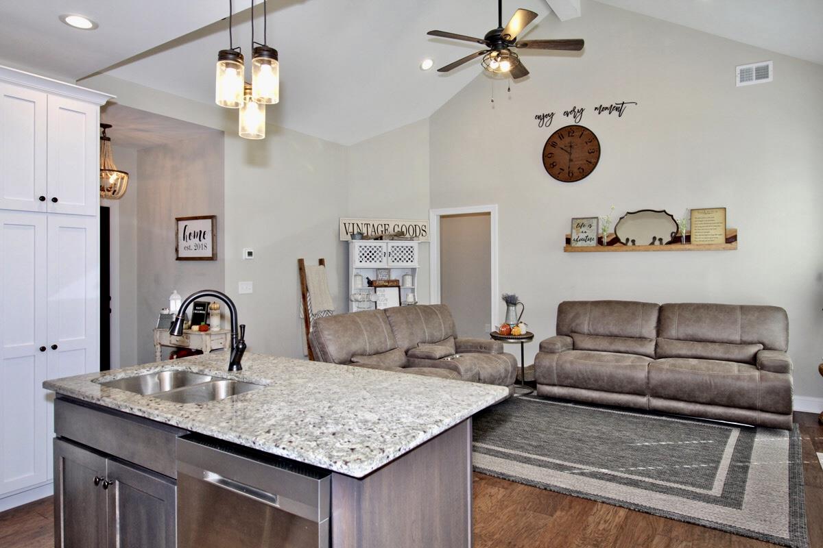 1044 Luton Way White House, TN 37188 - Photo 11 of 26 a kitchen with a faucet a chandelier and living area view