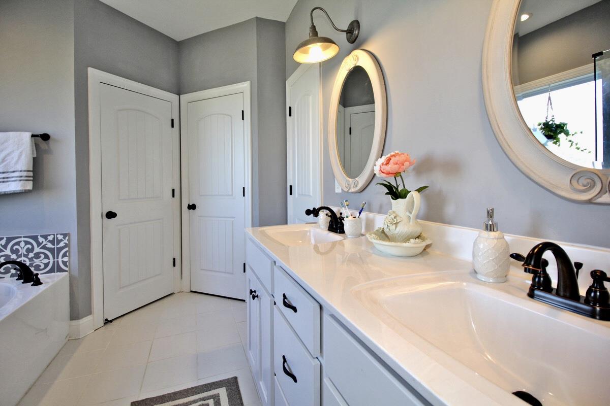 1044 Luton Way White House, TN 37188 - Photo 13 of 26 a bathroom with a sink and a mirror