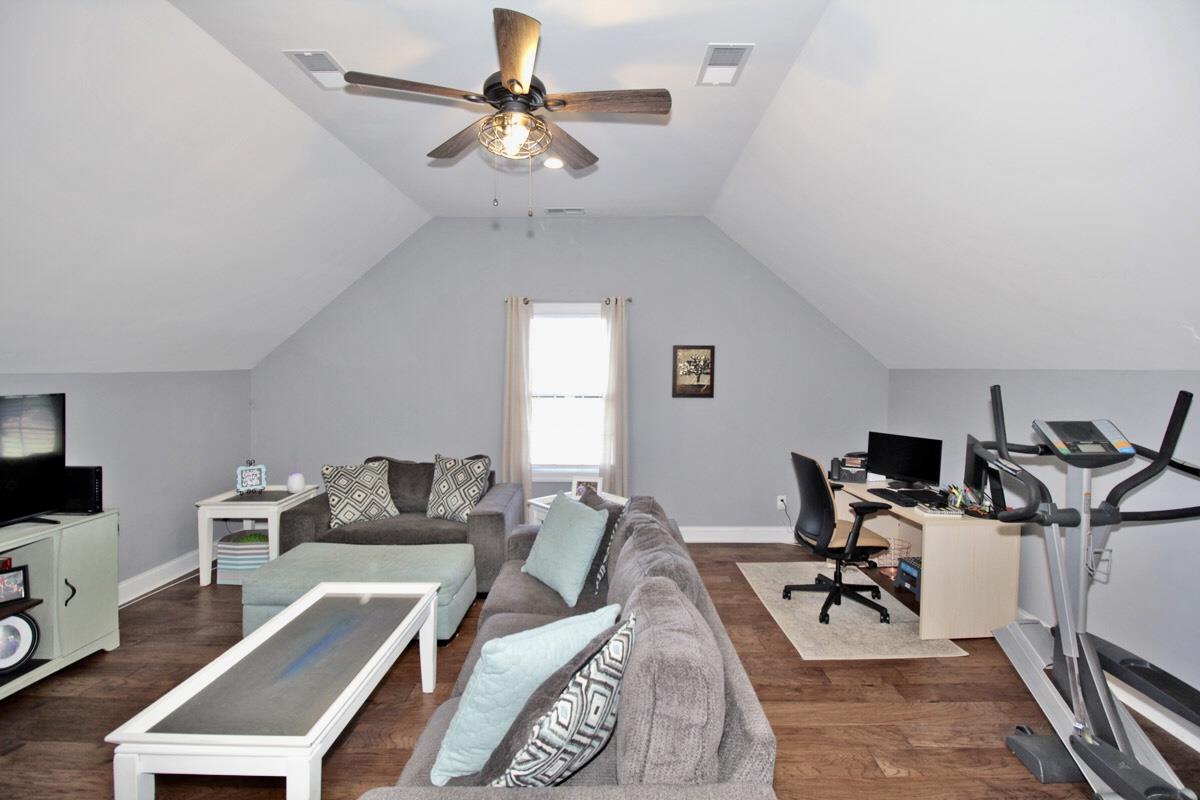 1044 Luton Way White House, TN 37188 - Photo 17 of 26 a living room with furniture a chandelier and a flat screen tv