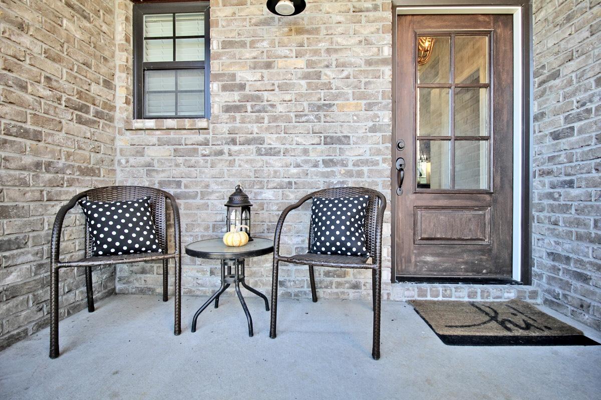 1044 Luton Way White House, TN 37188 - Photo 4 of 26 a table and chair in a room with wooden floor and a door