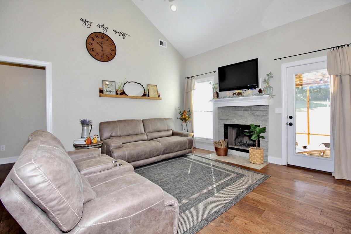 1044 Luton Way White House, TN 37188 - Photo 6 of 26 a living room with furniture a flat screen tv and a fireplace