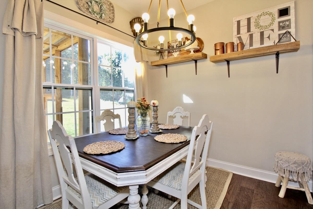 1044 Luton Way White House, TN 37188 - Photo 9 of 26 a view of a dining room with furniture window and wooden floor