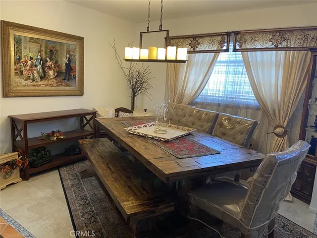a view of a dining room with furniture and window