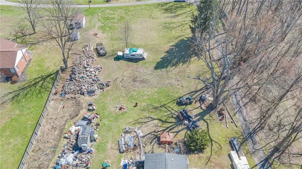 a aerial view of a house with a yard