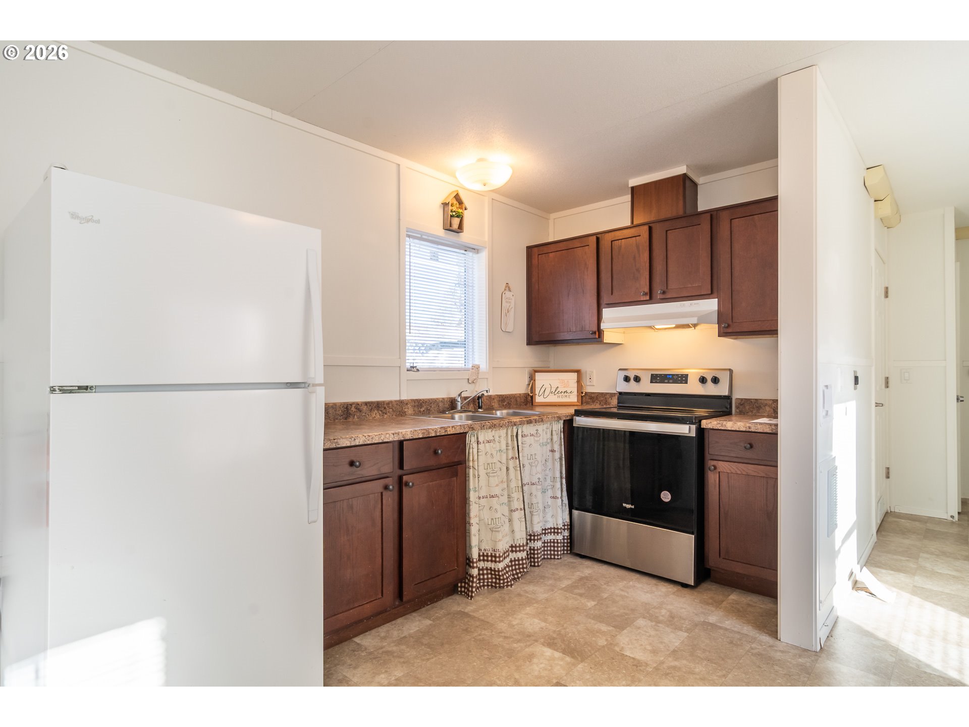 5000 Northeast Stephens Street, Unit 40 Roseburg, OR 97470 - Photo 14 of 27 a kitchen with a refrigerator and a sink
