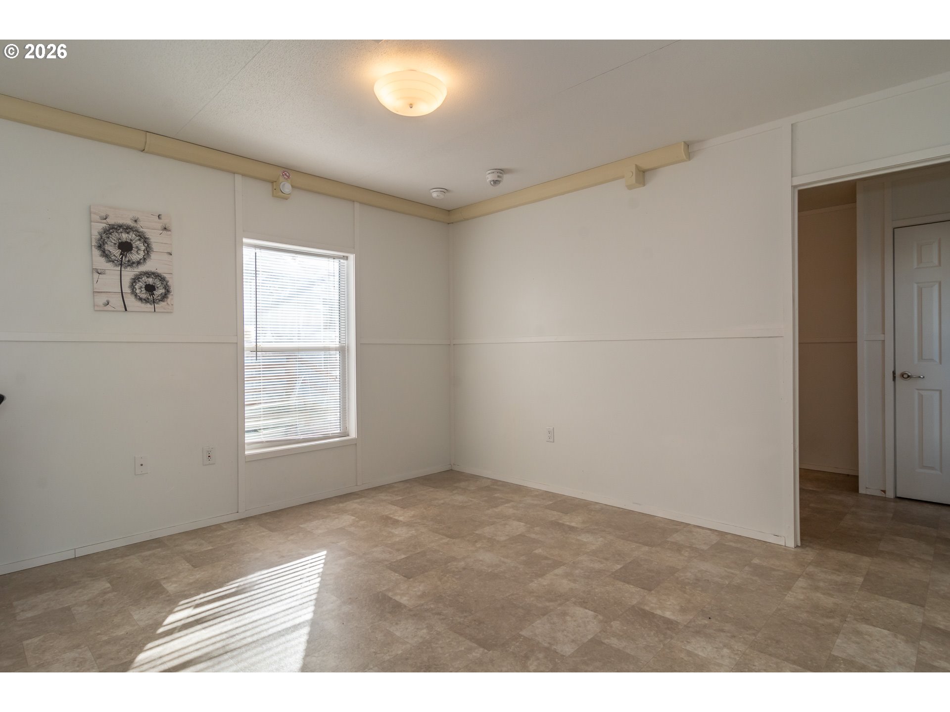 5000 Northeast Stephens Street, Unit 40 Roseburg, OR 97470 - Photo 6 of 27 a view of an empty room with a window