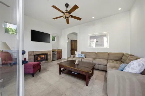 a spacious bedroom with a bed and a ceiling fan