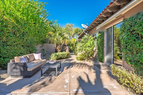 a view of a house with swimming pool garden and patio