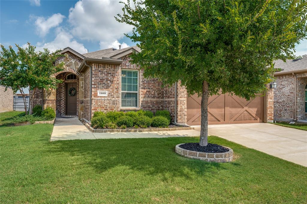 1509 Summit View Lane Little Elm, TX 76227 - Photo 1 of 1 a front view of a house with garden and trees