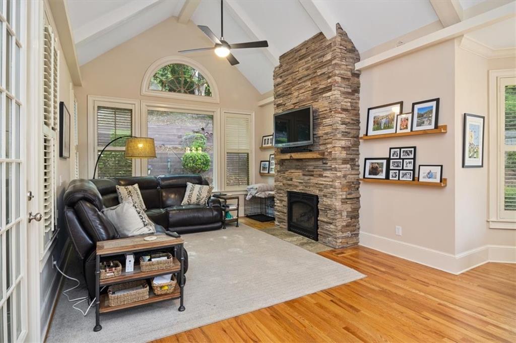 208 Grandmar Chase Canton, GA 30115 - Photo 18 of 67 a living room with furniture a fireplace and a flat screen tv