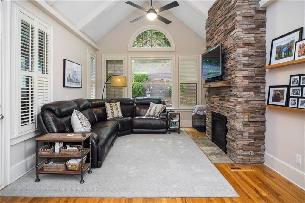 208 Grandmar Chase Canton, GA 30115 - Photo 19 of 67 a living room with furniture a fireplace and a window