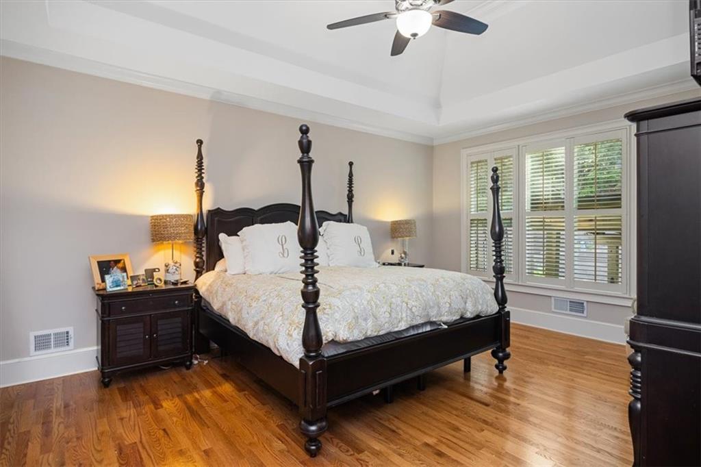 208 Grandmar Chase Canton, GA 30115 - Photo 25 of 67 a bed sitting in a spacious bedroom next to a window
