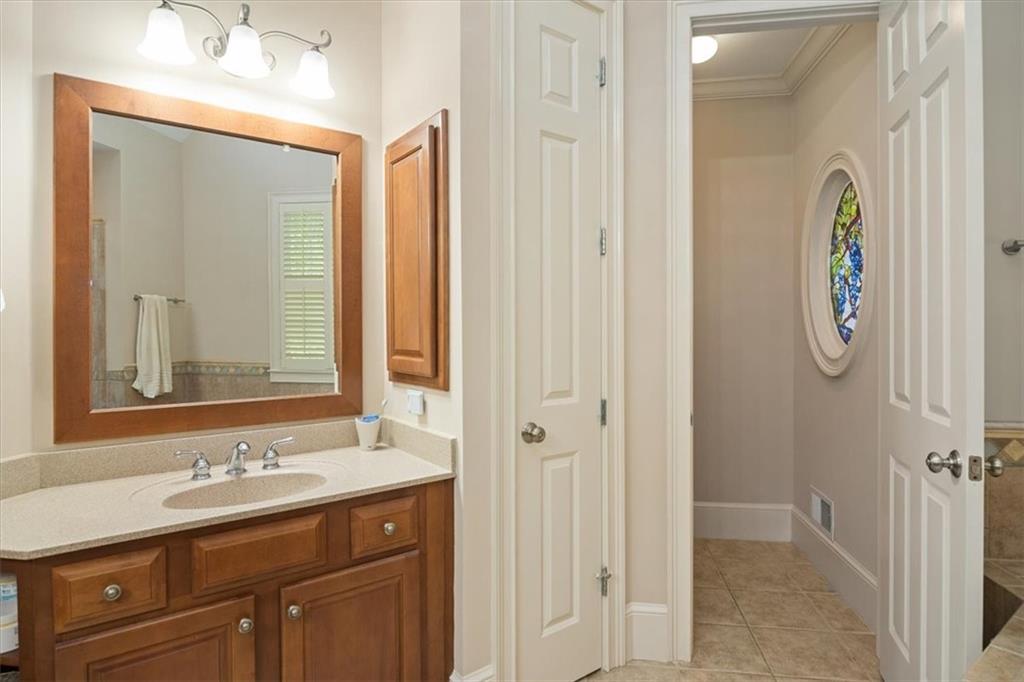 208 Grandmar Chase Canton, GA 30115 - Photo 29 of 67 a bathroom with a sink and a mirror