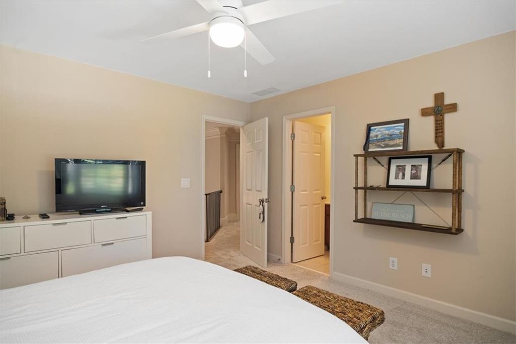 208 Grandmar Chase Canton, GA 30115 - Photo 32 of 67 a bedroom with a bed and a flat screen tv