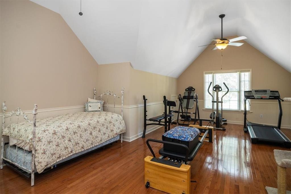208 Grandmar Chase Canton, GA 30115 - Photo 34 of 67 a bedroom with furniture and wooden floor
