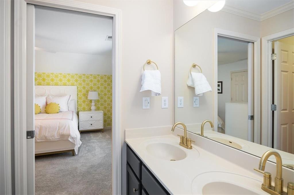 208 Grandmar Chase Canton, GA 30115 - Photo 35 of 67 a en suite bathroom with a granite countertop sink and a mirror