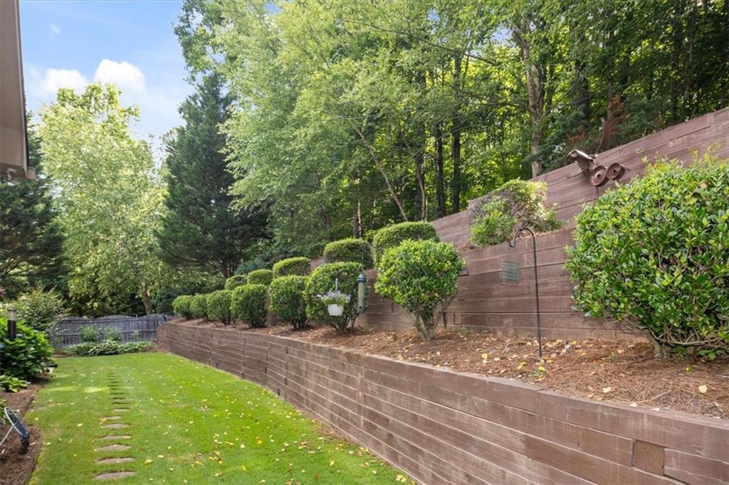 208 Grandmar Chase Canton, GA 30115 - Photo 53 of 67 a view of a backyard with potted plants and large trees