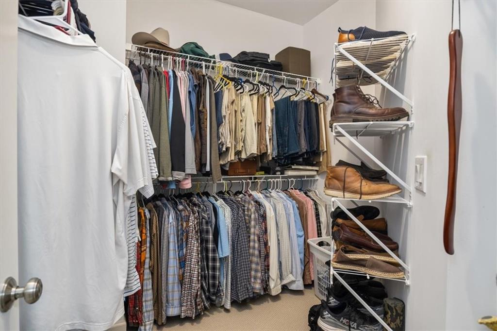208 Grandmar Chase Canton, GA 30115 - Photo 59 of 67 a view of walk in closet with clothes