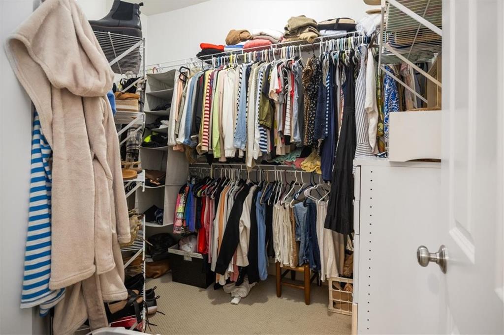 208 Grandmar Chase Canton, GA 30115 - Photo 60 of 67 a view of walk in closet with clothes