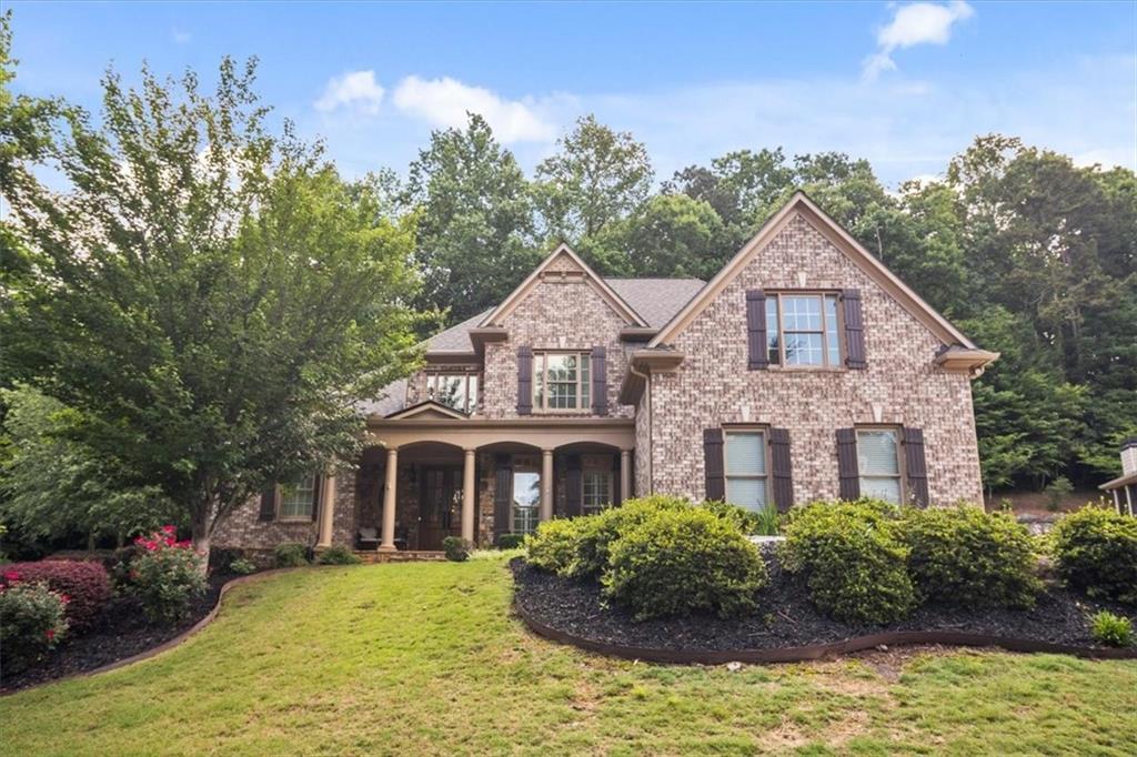 208 Grandmar Chase Canton, GA 30115 - Photo 64 of 67 a front view of a house with yard and green space
