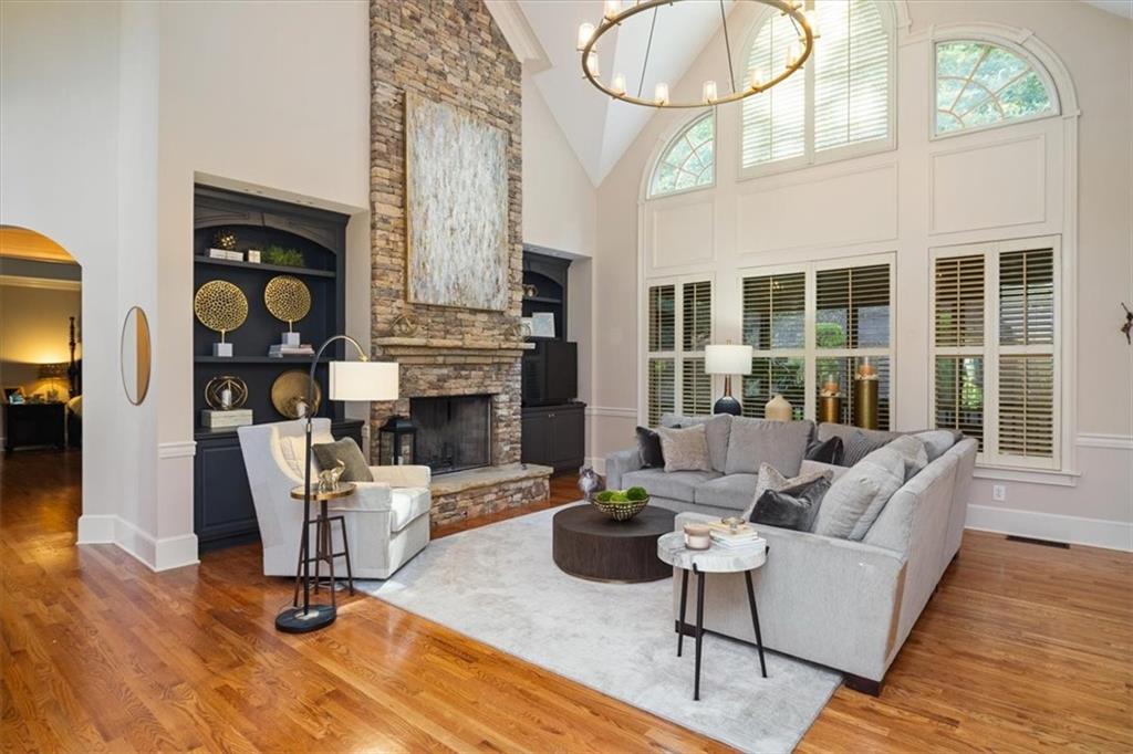 208 Grandmar Chase Canton, GA 30115 - Photo 10 of 67 a living room with fireplace furniture and a large window